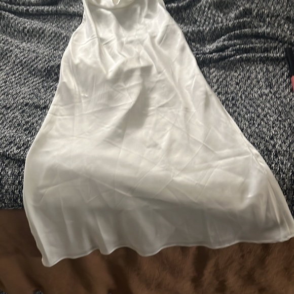 New mini white halter dress. Pearl like button details. Didn’t fit me. - Picture 2 of 3